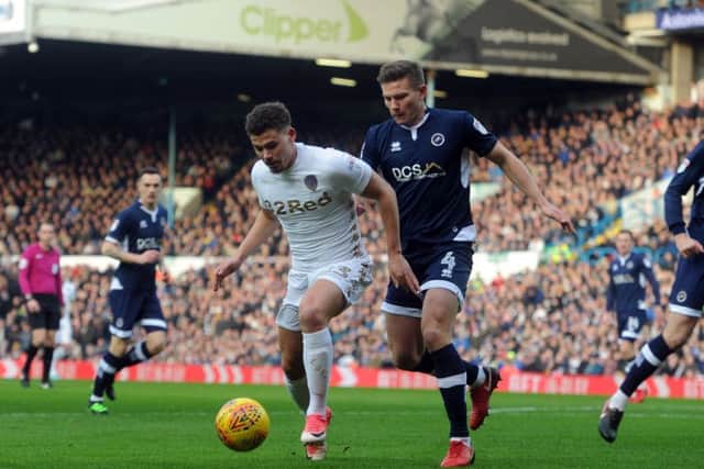 BANNED: Leeds United's Kalvin Phillips fends off  Millwall's Shaun Hutchinson. Picture: Tony Johnson.