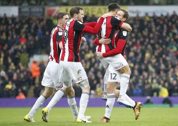 Straight in: James Wilson celebrates scoring on his Blades debut at Norwich. Picture: Simon Bellis/Sportimage