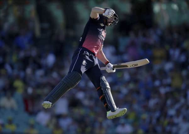 Jumping for joy: England's Jos Buttler celebrates his century. Picture: AP Photo/Rick Rycroft