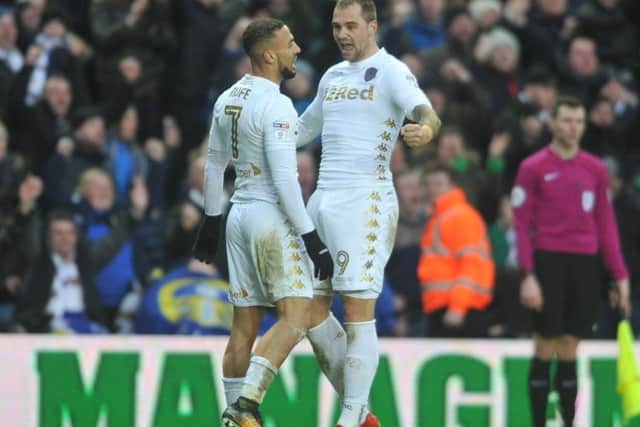 Hitting back: Pierre-Michel Lasogga celebrates his second goal with Kemar Roofe. It put Leeds ahead but Millwall struck back to win 4-3. Picture: Tony Johnson.