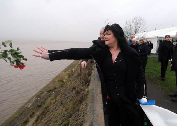Relatives throw flowers into the Humber at the annual Service to commemorate all lost trawler men. Picture Tony Johnson.