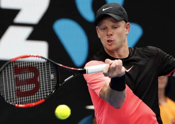 Britain's Kyle Edmund makes a forehand return to Italy's Andreas Seppi.