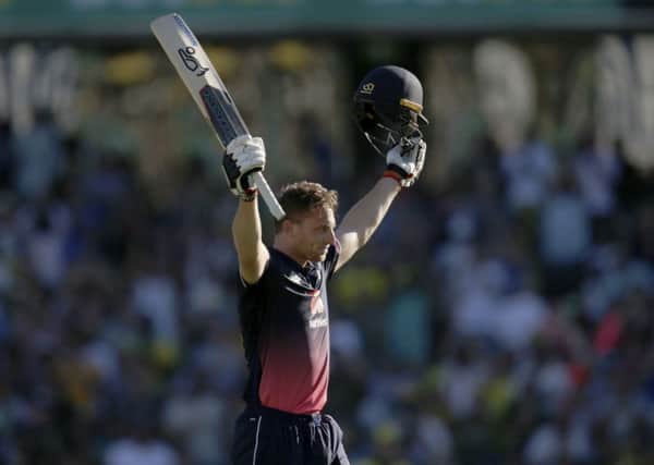 England's Jos Butler celebrates making 100 runs against Australia.