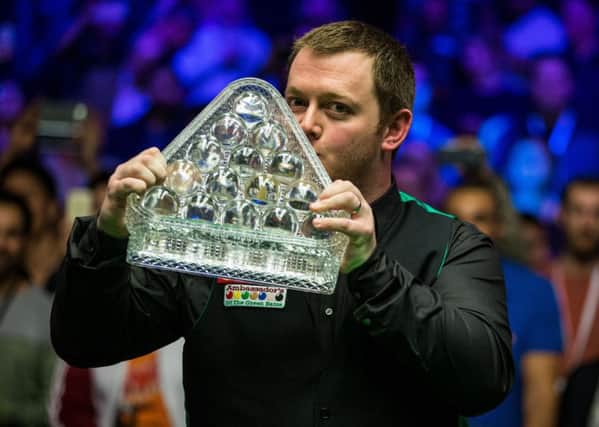 Mark Allen celebrates winning with the Masters trophy.