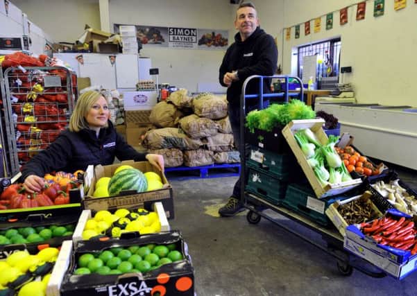Simon Baynes the owner of   Millies  fruit and vegetables shop on Bishopthorpe Road in York , pictured in the  wholesale  fruit and vegetables business   with his wife Leanne Raynes  he also owns in York.