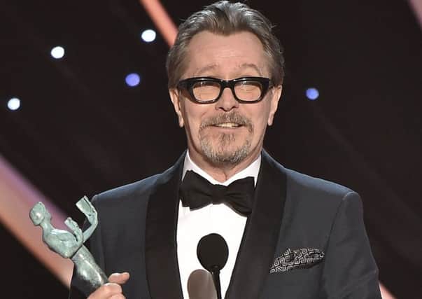 Gary Oldman accepts the award for outstanding performance by a male actor in a leading role for "Darkest Hour" at the 24th annual Screen Actors Guild Awards