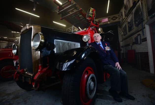 Frank Yates with a with World War Two fire engine at an exhibition to the Sheffield Blitz
