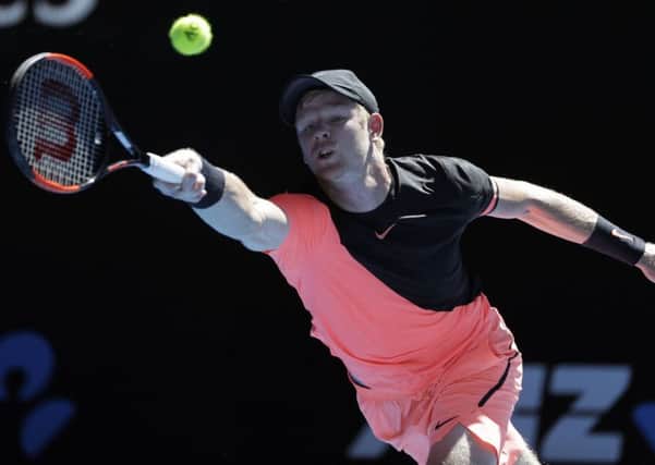 Stretching for supremacy: Kyle Edmund reaches for a forehand return to Grigor Dimitrov during their quarter-final at the Australian Open. (Picture: AP Photo/Dita Alangkara)