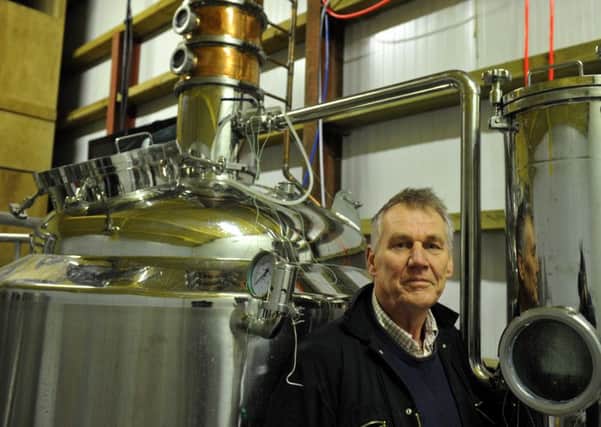 David Rawlings with the distilling equipment for his potato vodka at Priory Farm.