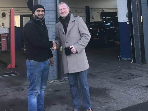 Ersilan Hussain, owner of Auto Performance Centre Garage, in Elland Road, with Gazza.