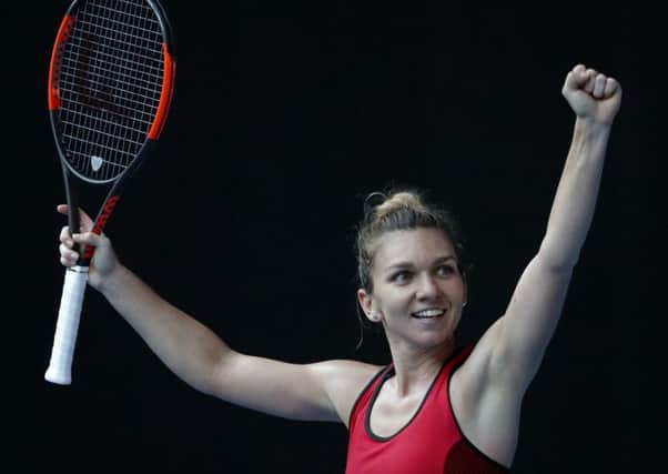 Romania's Simona Halep celebrates after defeating Germany's Angelique Kerber in their semifinal of the Australian Open  (AP Photo/Vincent Thian)