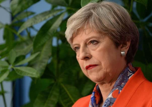 Why did Theresa May lose her majority in last year's election?