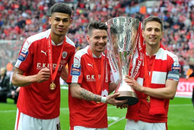 Proud day: Ashley Fletcher, Adam Hammill and Conor Hourihane after Barnsley's play-off win at Wembley.