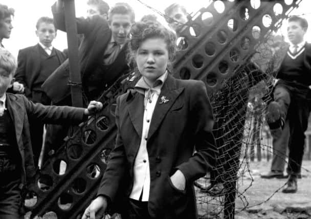 Featured in the exhibition: In Your Dreams, a photo by Ken Russell, January, 1955,  from a series: "The Last of the Teddy Girls" featuring 14 year old Jean Rayner in the exploratory stage of Teddyism.