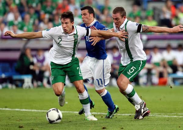 Republic of Ireland's Sean St Ledger, left in action against Italy at Euro 2012. Picture: Niall Carson/PA