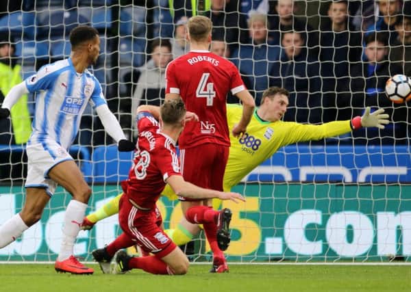 Heading in: Huddersfield Town's Steve Mounie scores his side's goal against Birmingham City in the FA Cup.