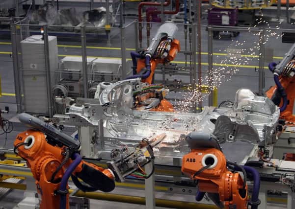 Robots on a production line, as a new report predicts that one in five jobs in British cities is likely to be displaced by 2030 because of automation and globalisation. Picture: Steve Parsons/PA Wire