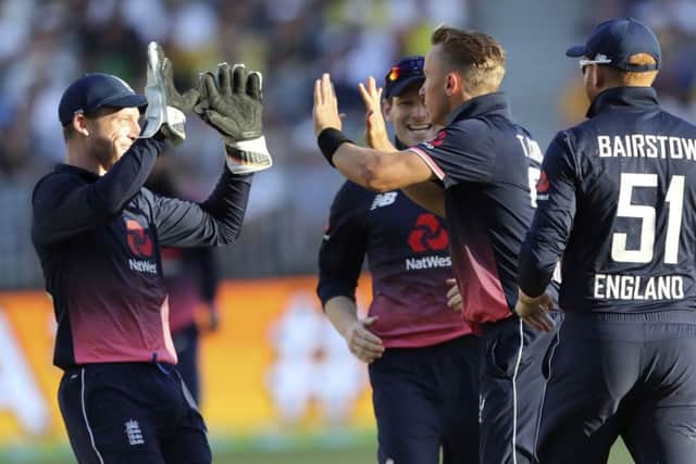 Englands Jos Buttler, left, and Tom Curran celebrate the dismissal of Australias Mitchell Starc, one of five wickets for Curran that included that of David Warner (Picture: Trevor Collens/AP).