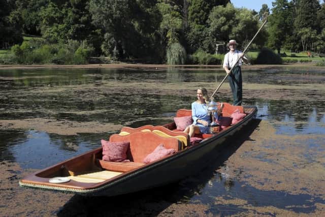 WINNER: Denmark's Caroline Wozniacki is taken for a ride on a punt with her Australian Open trophy, the Daphne Akhurst Memorial Cup in the Royal Botanical Gardens in Melbourne. Picture: AP/Dita Alangkara