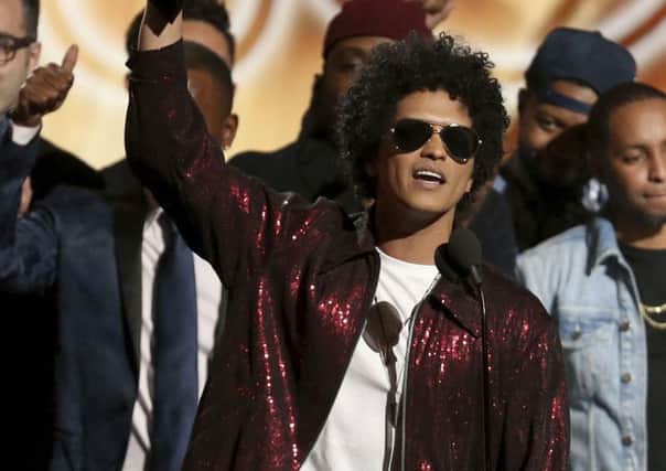 Bruno Mars accepts the award for album of the year