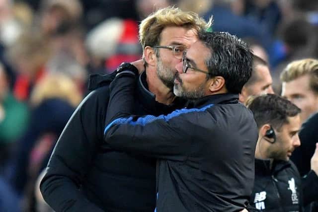 Liverpool manager Jurgen Klopp (left) and Huddersfield Town manager David Wagner embrace after the final whistle during the Premier League match at Anfield earlier this season (Picture: Dave Howarth/PA Wire)