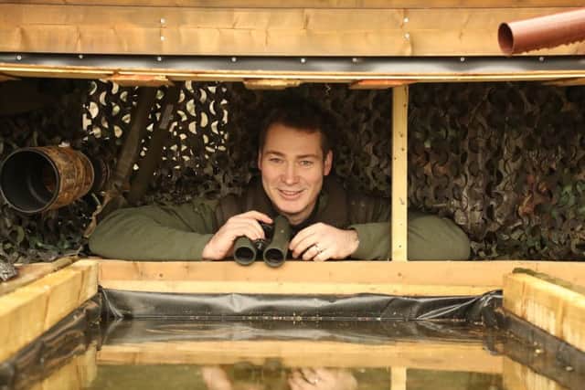 Wildlife artist Robert at his purpose-built hawfinch hide at the Yorkshire Arboretum.