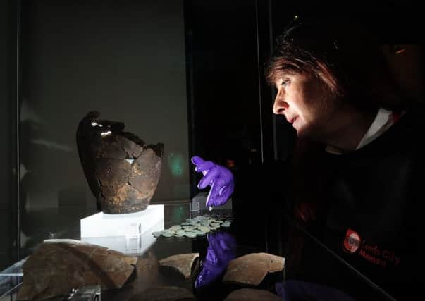 Joanne Medd looks at the Roman Piggy Bank at Leeds Museum..31st January 2018 ..Picture by Simon Hulme