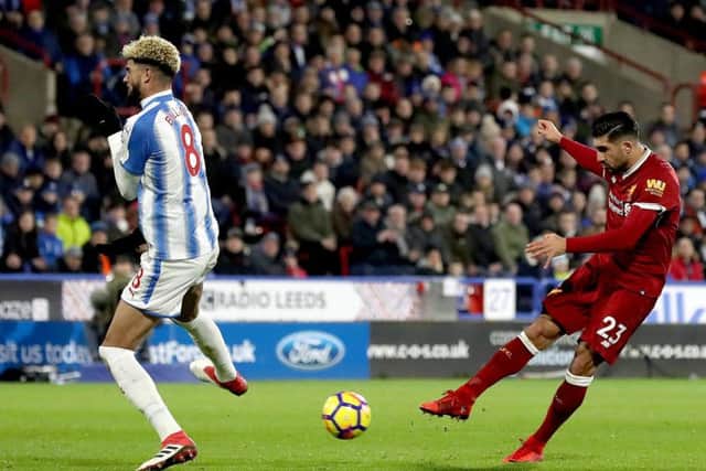 OPENING SALVO: Liverpool's Emre Can scores his side's first goal of the game against Huddersfield Town. Picture: Martin Rickett/PA