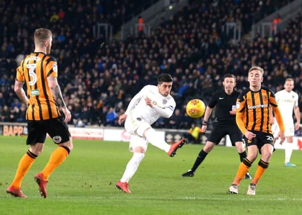 Leeds United's Pablo Hernandez fires in a shot as Hull City's Jarrod Bowen, right, looks on.  Picture: Bruce Rollinson