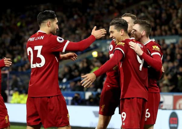 Liverpool's Roberto Firmino (third right) celebrates scoring his side's second goal of the game during the Premier League match at the John Smith's Stadium, Huddersfield. (Picture: Martin Rickett/PA Wire)
