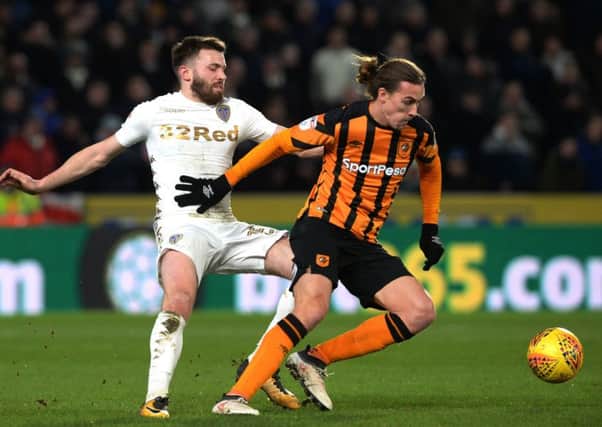 Stuart Dallas is held off the ball by Jackson Irvine. (Picture: Bruce Rollinson)