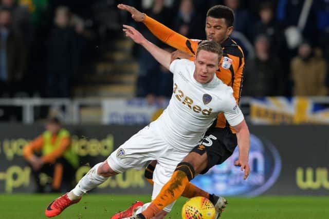 Adam Forshaw and Fraizer Cambell challenge for the ball during Hull City and Leeds United's goalless draw on Tuesday night. (Picture: Bruce Rollinson)