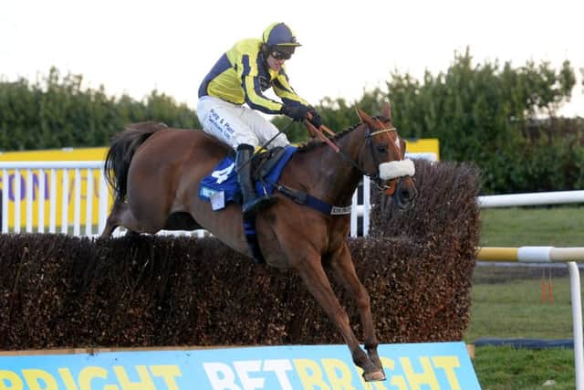 The Last Samuri ridden by David Bass clear the final fence on their way to winning The BetBright Grimthorpe Chase at Doncaster Racecourse. (Picture: Anna Gowthorpe/PA Wire)