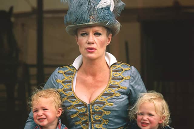 Nell Gifford, who founded Gifford's Circus with Toti Gifford. Nell is pictured here dressed in riding regalia with their children Red and Cecil. Nell is a regular equestrian performer, and the children sometimes make an appearance at weekends.