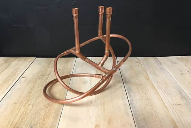 Pipe Creative
Copper pipes reworked into a stunning candelabra. 
Picture Jody Clarke