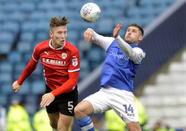 Angus MacDonald playing for Barnsley against Sheffield Wednesday earlier this season. (Picture: Steve Ellis)