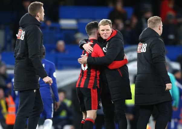 AFC Bournemouth manager Eddie Howe (centre right) celebrates after the final whistle.