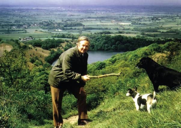 Herriot

Alf Wight with dogs on  Sutton Bank- Lake Gormire in the background.