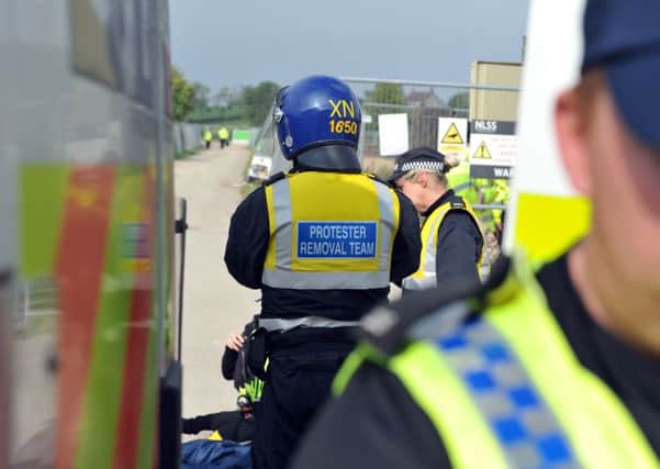 27 September 2017......     North Yorkshire Police work to free protestors chained together in the entrance to Third Energy's fracking site in Kirby Misperton near Malton. Picture Tony Johnson.