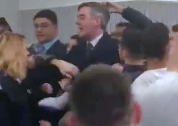 Tory MP Jacob Rees-Mogg being caught in the middle of a scuffle at the University of the West England, in Bristol.