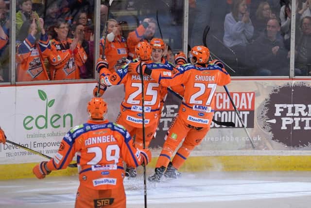 HOW'S THAT FOR STARTERS: Liam Kirk is congratulated by his team-mates after his third-minute equaliser against Nottingham Panthers. Picture: Dean Woolley