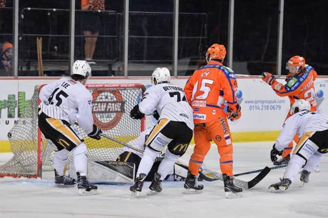 GREAT LEVELLER: Jonas Westerling, far right, fires home Sheffield Steelers third goal against Nottingham Panthers. Picture: Dean Woolley.