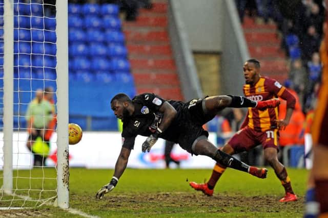 Latics keeper Johnny Placide gifts Bradford a consolation goal, palming a cross into his own net.  PIC: Tony Johnson