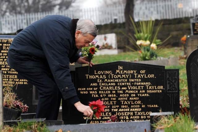 Dickie Bird visits the grave of Tommy Taylor at Monk Bretton cemetery in December, 2007.
