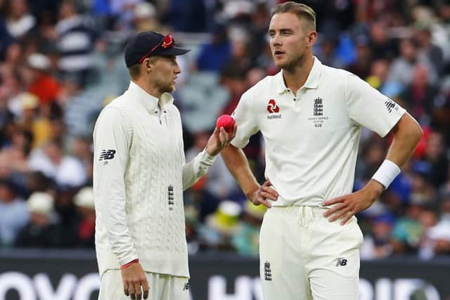 LEADING EXAMPLE: England captain Joe Root discusses tactics with Stuart Broad during the Ashes Test match at the Adelaide Oval. Picture: Jason O'Brien/PA.