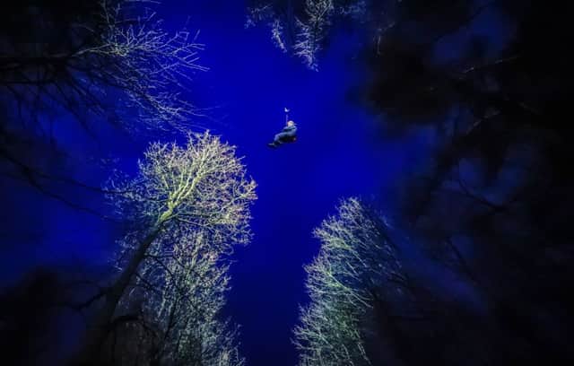 A man tests a new Go Ape night-time zipline experience that will form part of the Dark Skies Festival