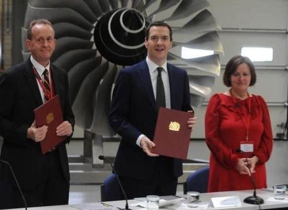 Julie Dore and Sir Steve Houghton sign the Sheffield City Region devolution deal with then chancellor George Osborne.