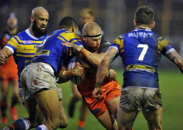 Castleford Tigers forward Oliver Holmes attacks in last month's friendly with Leeds Rhinos (Picture: Tony Johnson).