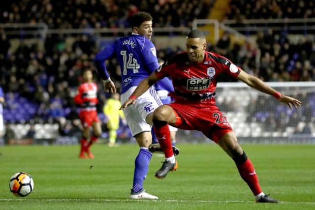 Birmingham City's Che Adams (left) and Huddersfield Town's Mathias Jorgensen battle for the ball at St Andrews,. Picture: Martin Rickett/PA