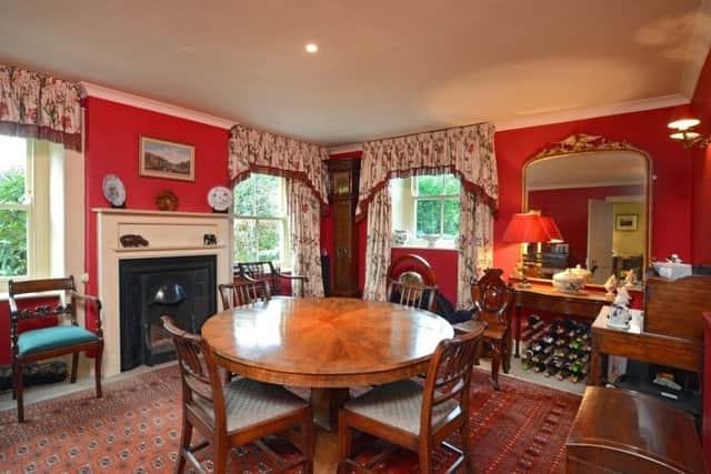 The dining room in rich Georgian red
